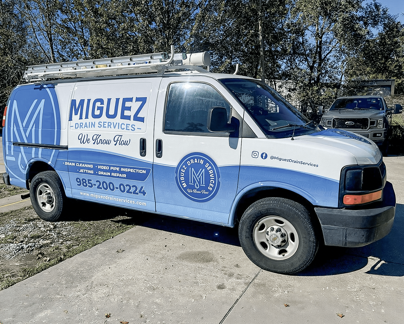 Miguez Drain Services blue commercial van wrap