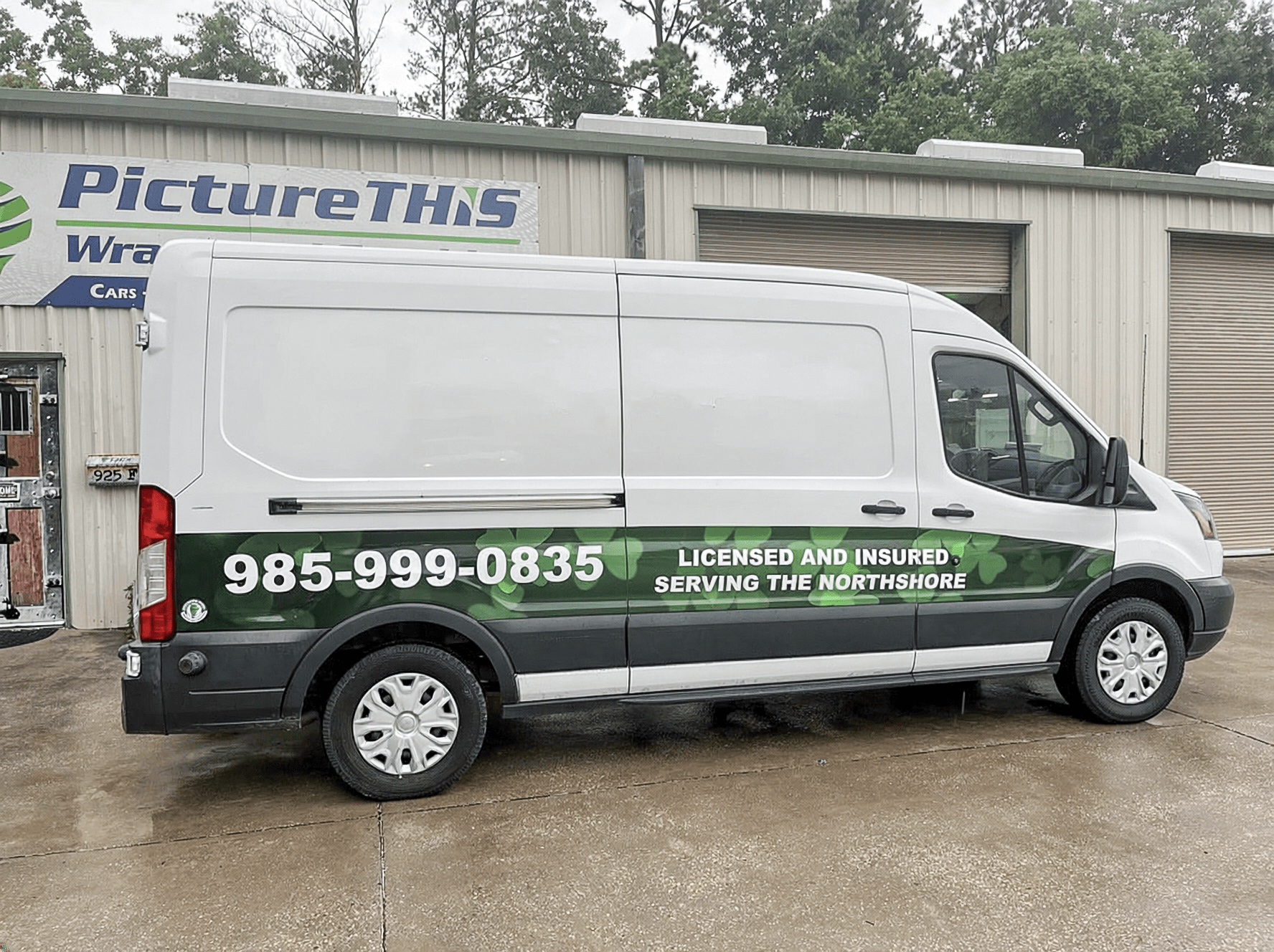 Northshore plumbing service van partial wrap with green graphics