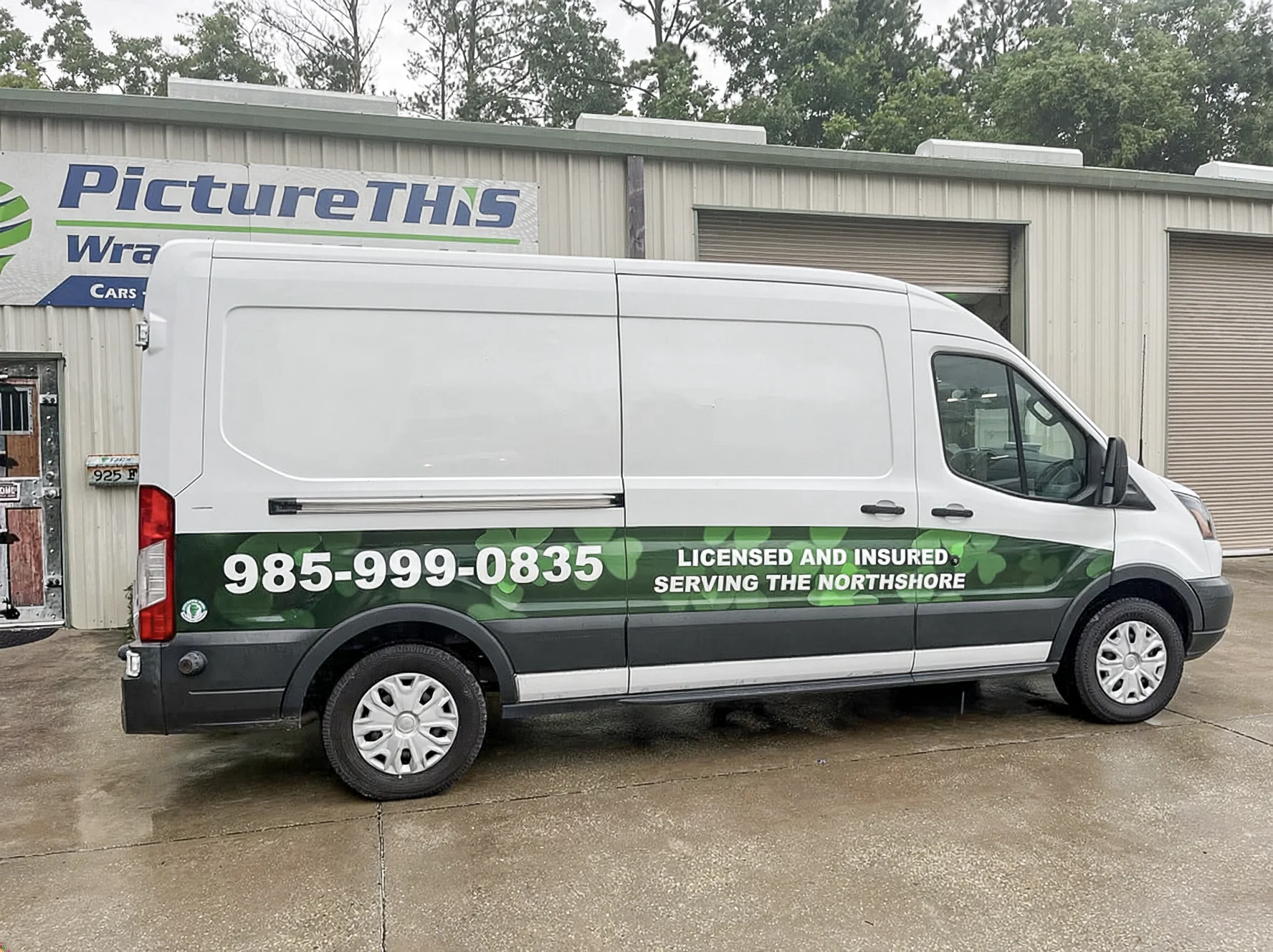 Northshore plumbing service van partial wrap with green graphics