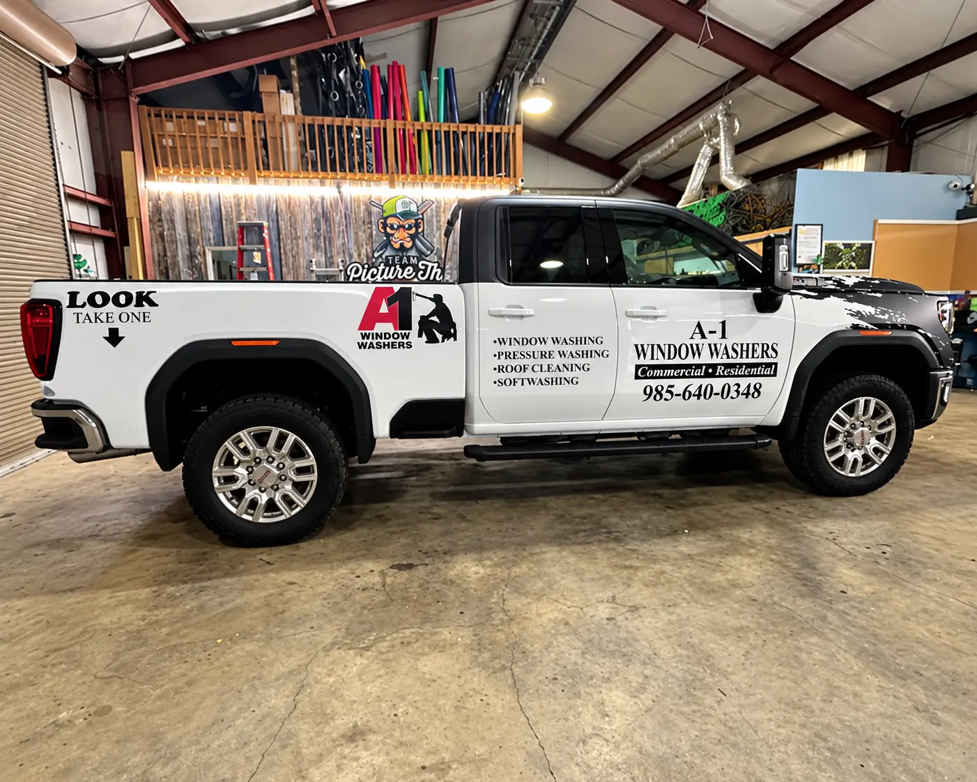 A1 Window Washers pickup truck graphics for commercial window cleaning