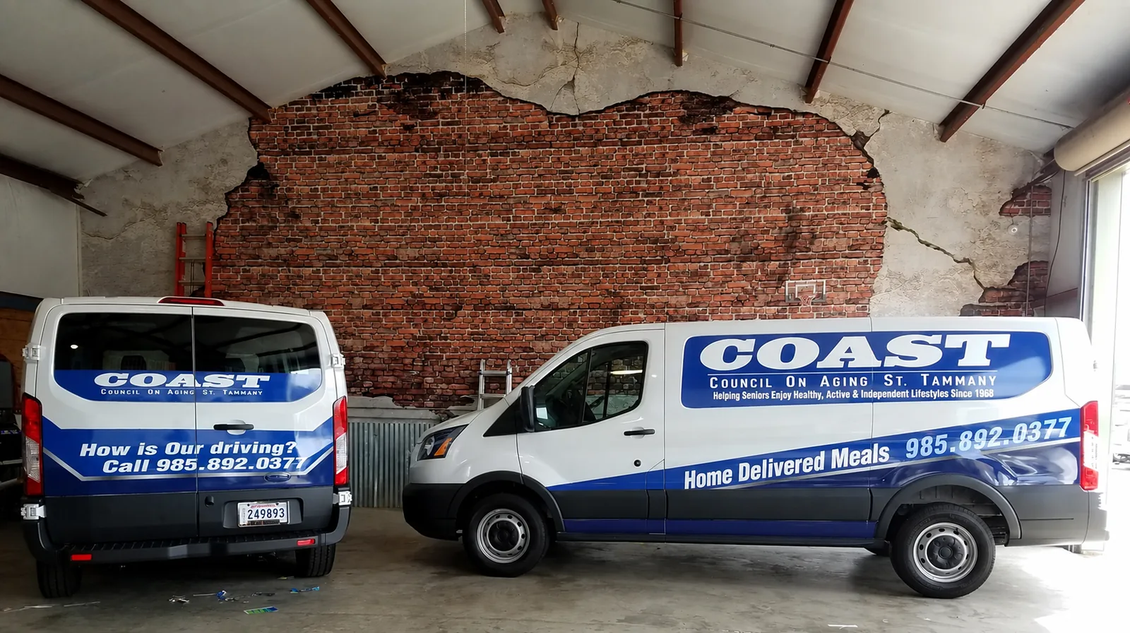 COAST community service vans with fleet graphics