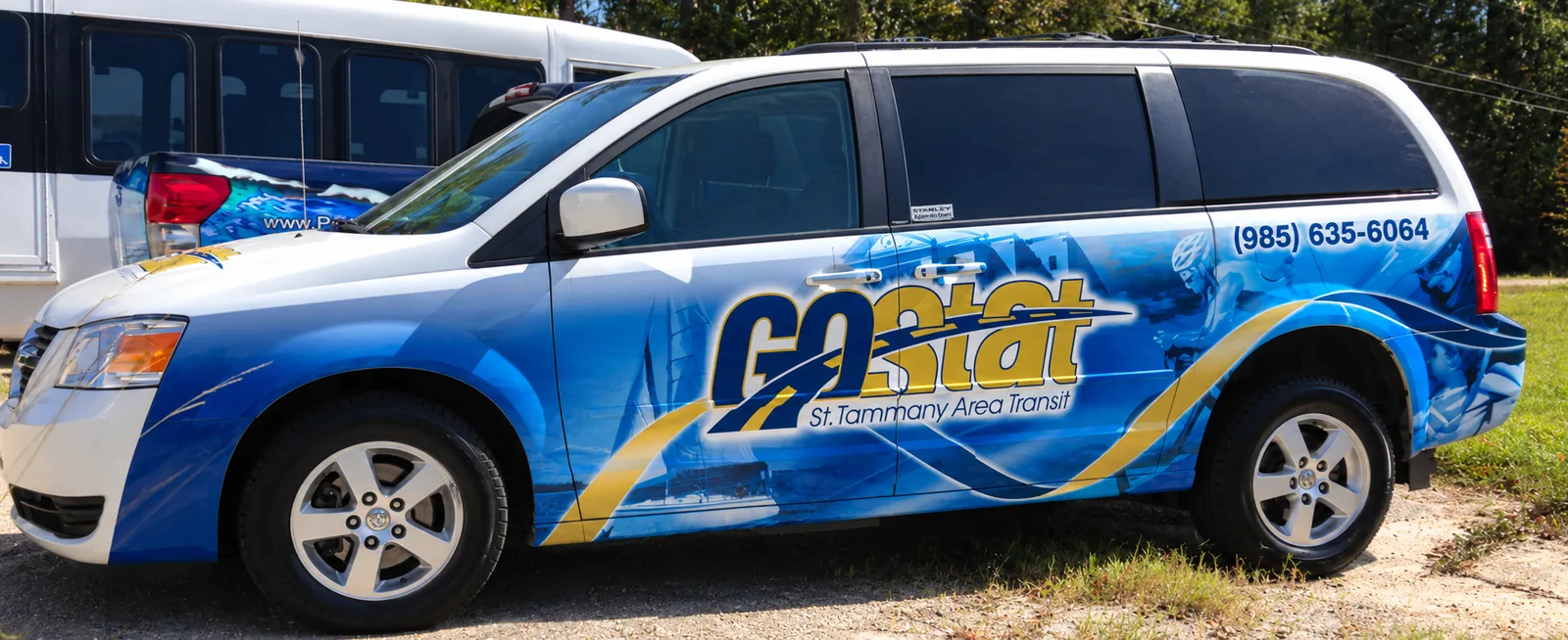 GoStat parish transportation minivan partial wrap, single side view