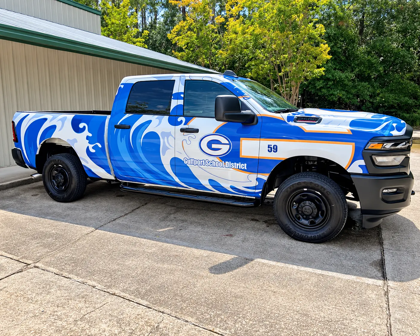 Gulfport School District pickup truck full wrap in blue, white, and orange