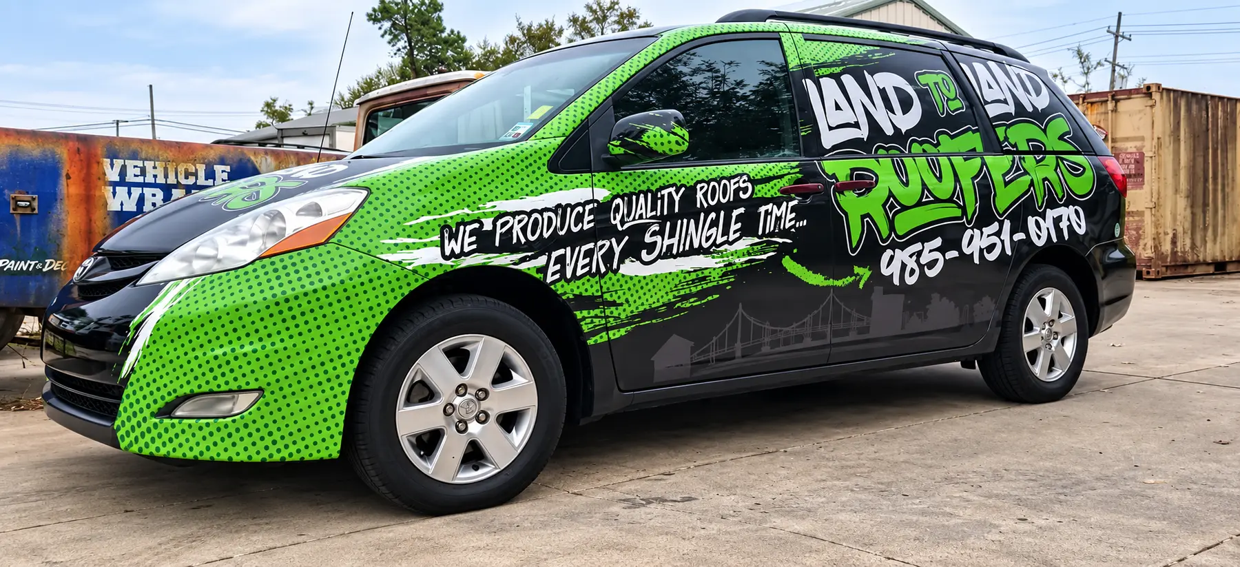 Land to Land Roofers minivan with a green and black commercial vehicle wrap