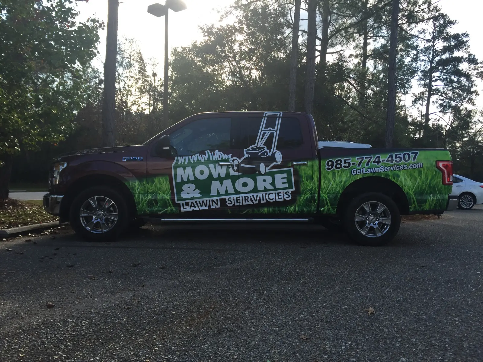 Mow and More lawn service pickup truck wrap side view