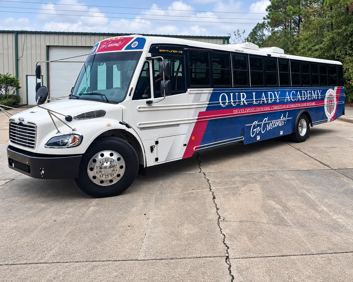 Our Lady Academy partial shuttle bus wrap