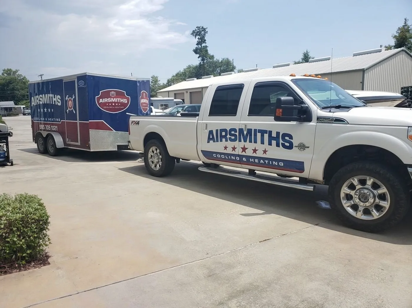 Airsmiths matching HVAC pickup and enclosed trailer graphics