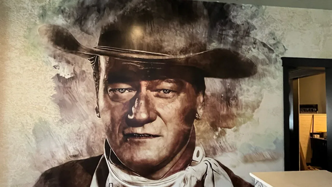Custom John Wayne wall mural installed at a business